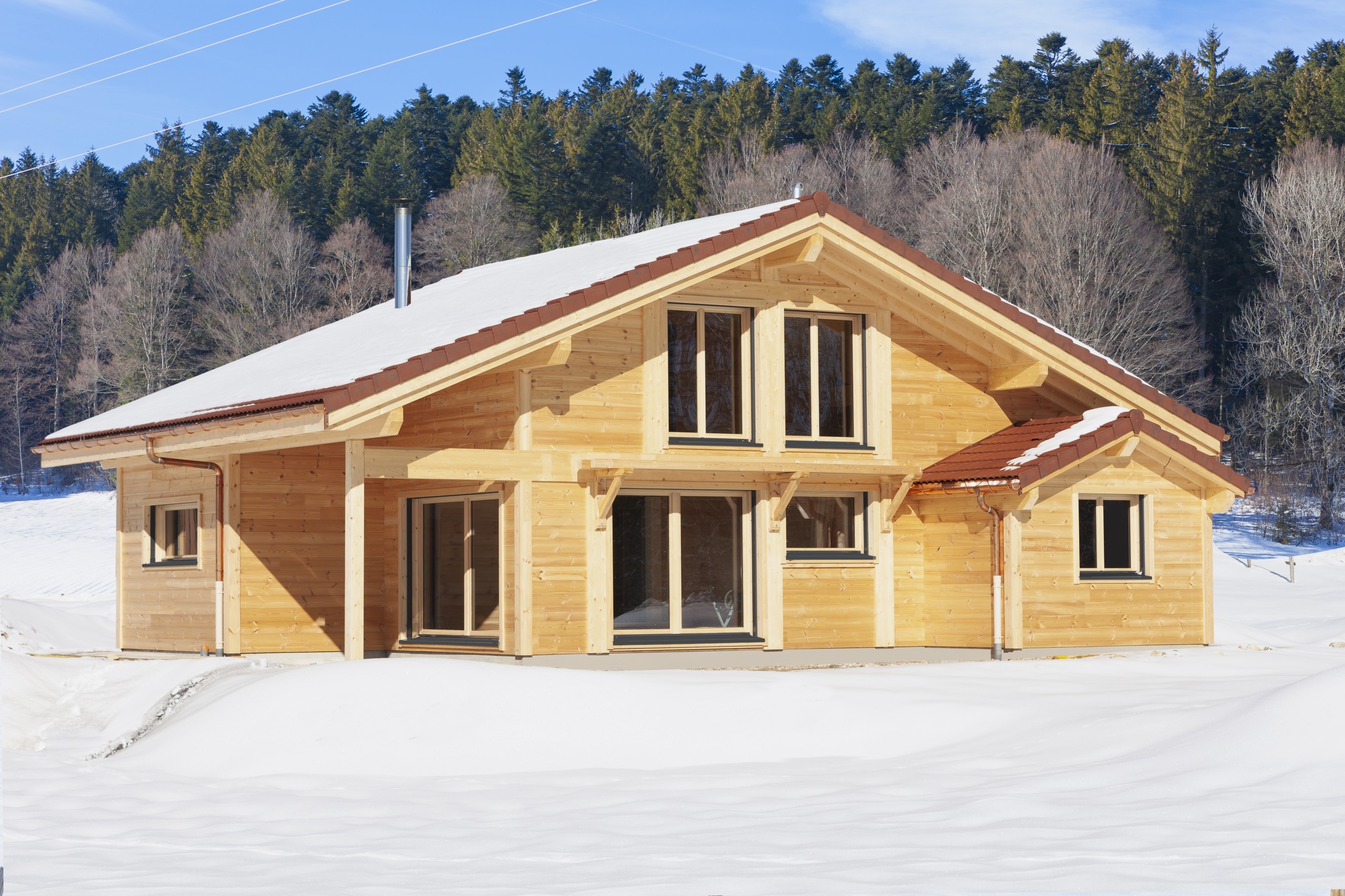Chalet traditionnel en poteau-poutre sous la neige (Les Ellais, Ville-du-Pont)